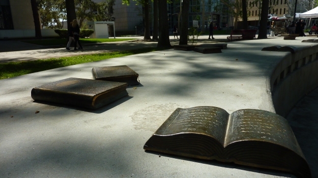 bench with book sculpture art attached in front of Van Nuys Branch Library.